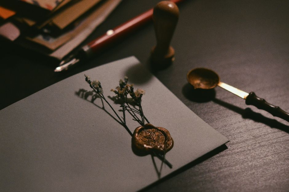 Official document with wax seal on a desk