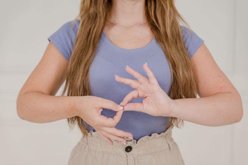 Close-up of a woman communicating through sign language